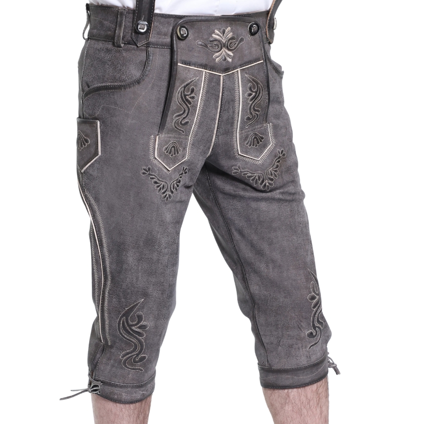 Angled shot of ash grey lederhosen showing intricate embroidery and knee ties.
