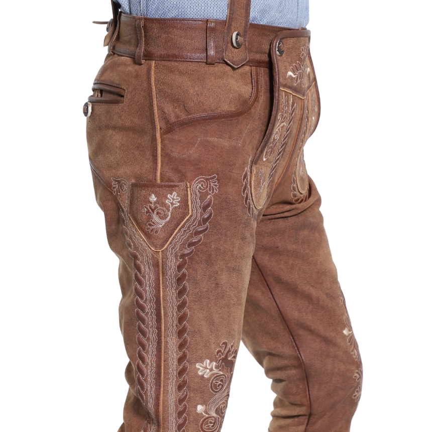 Side view of rustic oak Bavarian bundhosen showing a richly embroidered pocket flap, braided seam accents, and detailed side embroidery above the knee.
