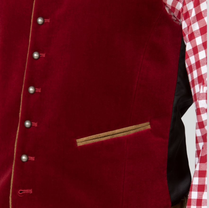 Closeup of maroon velvet vest pocket with contrast piping and metal buttons.